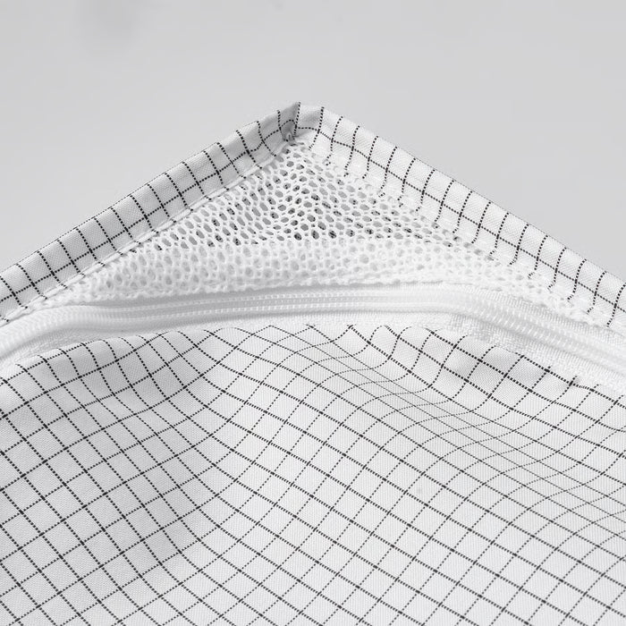  Close-up of IKEA STUK mesh zip fabric showing breathable diamond weave detailing