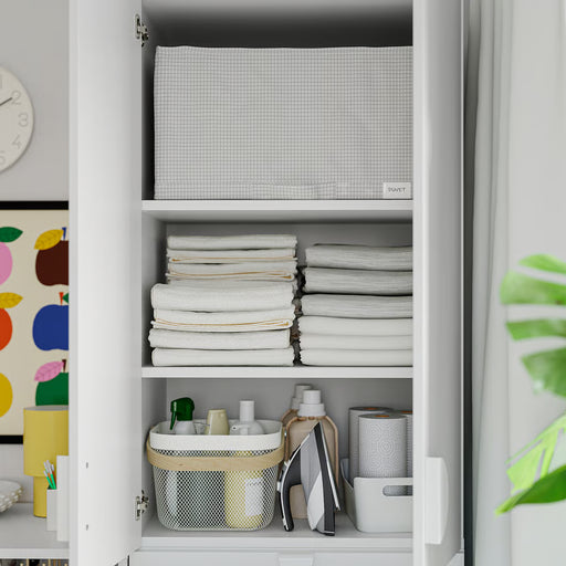  Open closet with folded towels, toiletries basket and IKEA STUK mesh storage bin