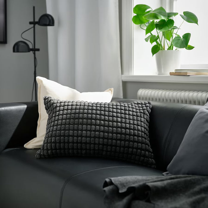 IKEA SVARTPOPPEL anthracite cushion cover styled on light grey sofa living room setting