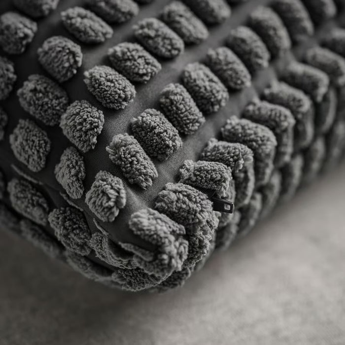  Close-up of IKEA SVARTPOPPEL anthracite cushion cover showing tactile woven texture detail