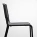 Close-up of the black IKEA TEODORES Chair, highlighting its modern aesthetic and sturdy backrest-00530622