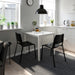 IKEA TEODORES Chair in a dining setting, complementing the table with its stylish appearance-00530622