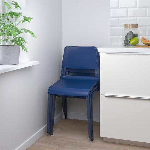 IKEA TEODORES blue chair styled in dining room with white cabinet and wall shelf