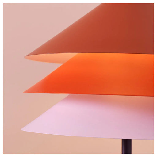  IKEA TESAMMANS multicolour lamp shade lit up showing warm decorative glow in room setting