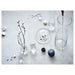 IKEA TIDVATTEN glass vases grouped with twigs and cotton decorations on grey concrete surface