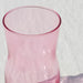 IKEA TIDVATTEN pink vase holding tulips close-up view