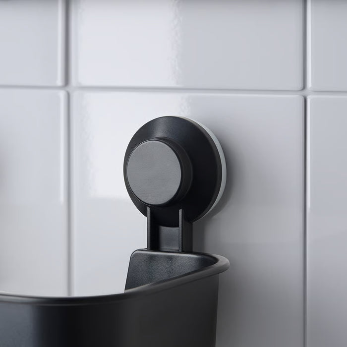 IKEA TISKEN black suction cup basket mounted on white tiled shower wall