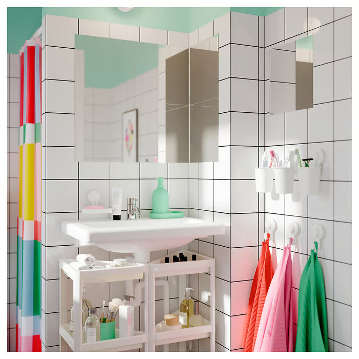  IKEA TISKEN white hook with suction cup close-up showing compact profile and circular base
