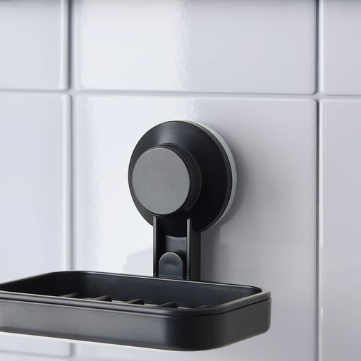IKEA TISKEN black soap dish mounted on white bathroom tiles with soap bar