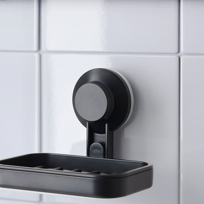 IKEA TISKEN black soap dish mounted on white bathroom tiles with soap bar