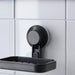 IKEA TISKEN black soap dish mounted on white bathroom tiles with soap bar
