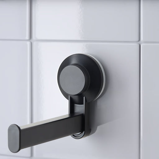 IKEA TISKEN black toilet roll holder stuck on smooth bathroom tiles with suction cup, no drilling needed