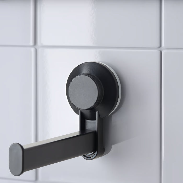 IKEA TISKEN black toilet roll holder stuck on smooth bathroom tiles with suction cup, no drilling needed