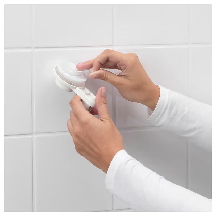 IKEA TISKEN white bathroom holder suction cup detail showing thermoplastic elastomer grip base