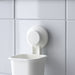 IKEA TISKEN white suction cup holder in use in small bathroom with multiple toothbrushes stored