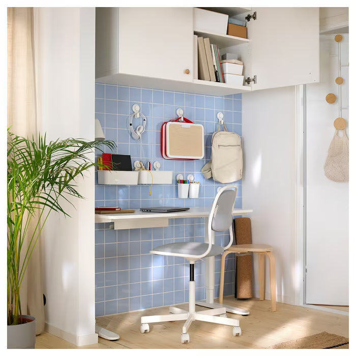 IKEA TISKEN white wall-mount holder with suction cup shown from side angle displaying full height