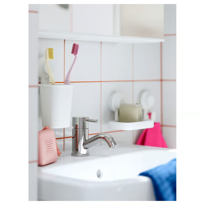 IKEA TISKEN white suction cup toothbrush holder close-up showing smooth rectangular body and grip mount