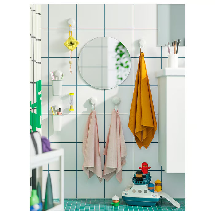  IKEA TISKEN white bathroom organiser with suction cup holding toothbrushes on glass shower panel