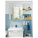IKEA TISKEN white toothbrush holder mounted on mirror surface in compact bathroom