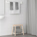  IKEA TISKEN white towel rack installed in bathroom corner near shower curtain compact fit