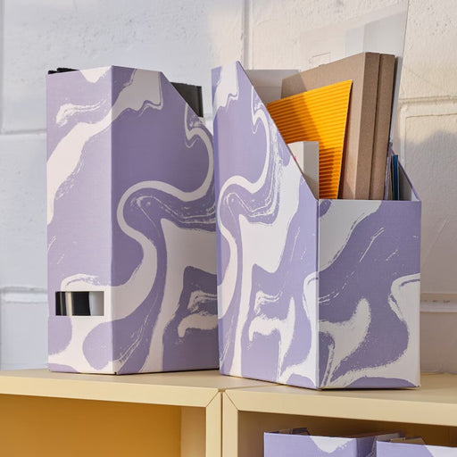 Eco-friendly magazine storage solution from IKEA TJENA, crafted from chlorine-free recycled paperboard.