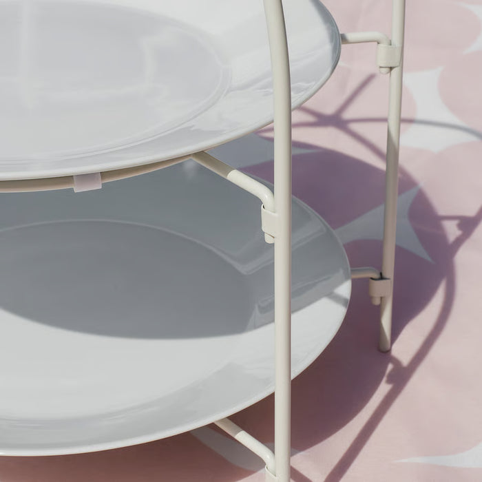 IKEA TOFSAND white plate stand styled on dining table holding two plates in a dinner setting