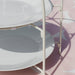  IKEA TOFSAND white plate stand styled on dining table holding two plates in a dinner setting
