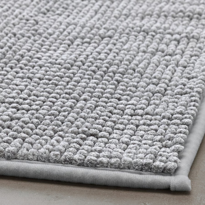 Close-up of IKEA TOFTBO soft textured bath mat showing plush quick-drying microfibre and durable edging