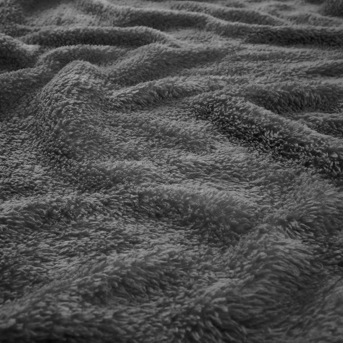  IKEA TRATTVIVA dark grey bedspread draped on bed cosy modern bedroom styling