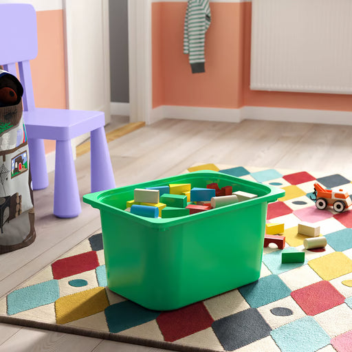 IKEA TROFAST bright green storage box in kids room with building blocks toys and TROFAST frame system