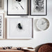 IKEA TROMMA white wall clock with black hands displayed above books and décor in a styled desk setup