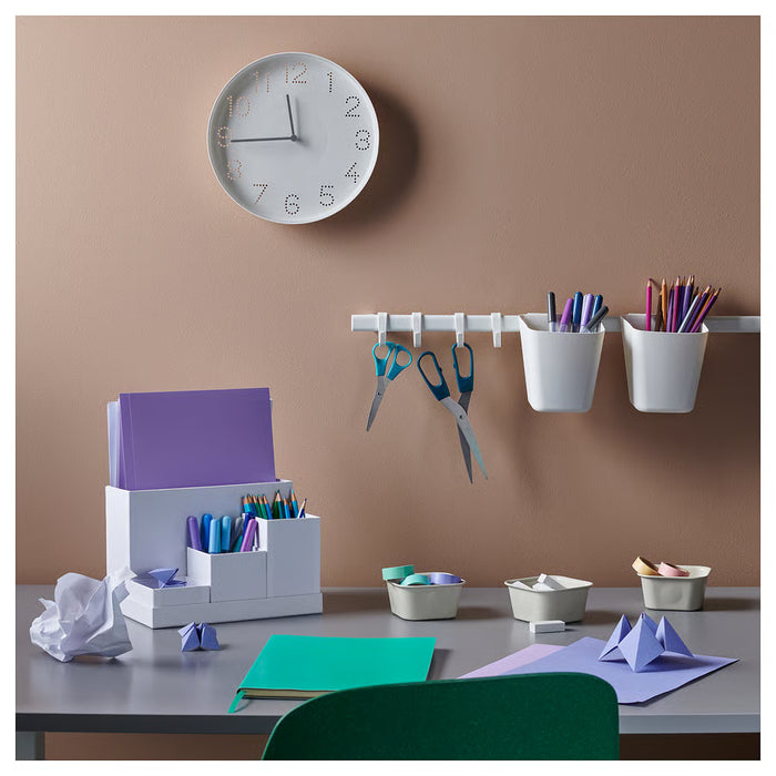 IKEA TROMMA white wall clock 25cm side angle showing slim profile and frame depth
