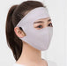 Woman wearing a gray face mask with a white background