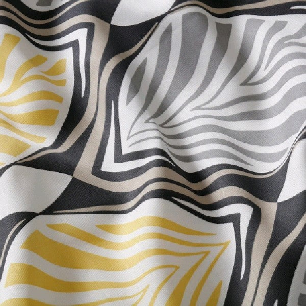 Close-up of HÄSTFIBLA fabric showing abstract geometric leaf motifs and soft texture, ideal for contemporary interiors
