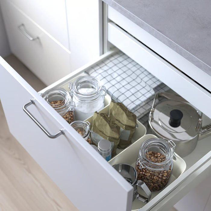 IKEA UPPDATERA white box inside open kitchen drawer holding glass jars and small 