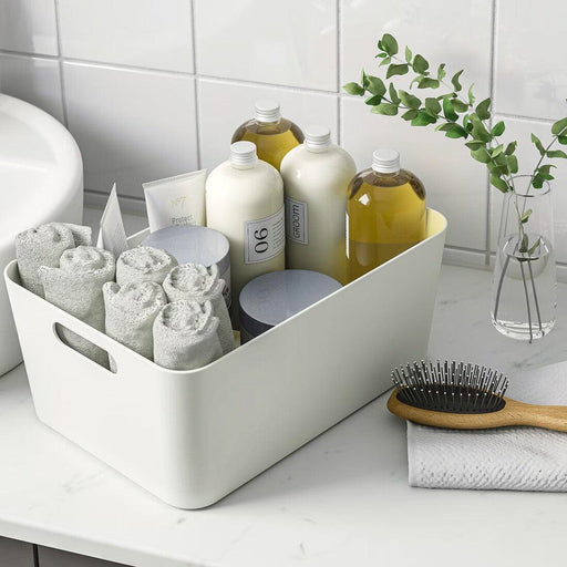 IKEA UPPDATERA white box holding towels and bottles on bathroom shelf portable organiser