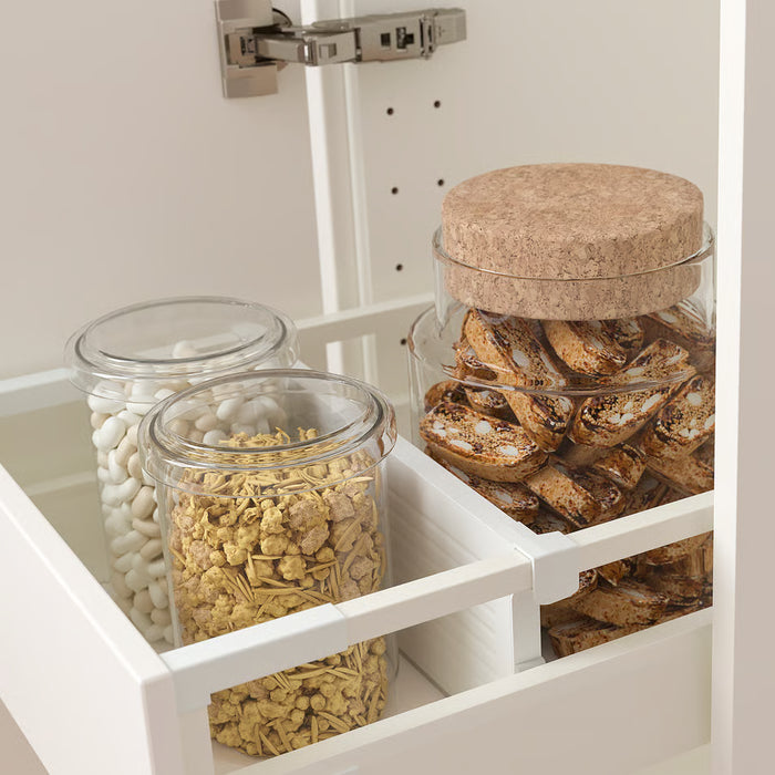 IKEA UPPDATERA drawer divider holding glass jars of marshmallows granola and biscotti