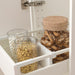 IKEA UPPDATERA drawer divider holding glass jars of marshmallows granola and biscotti