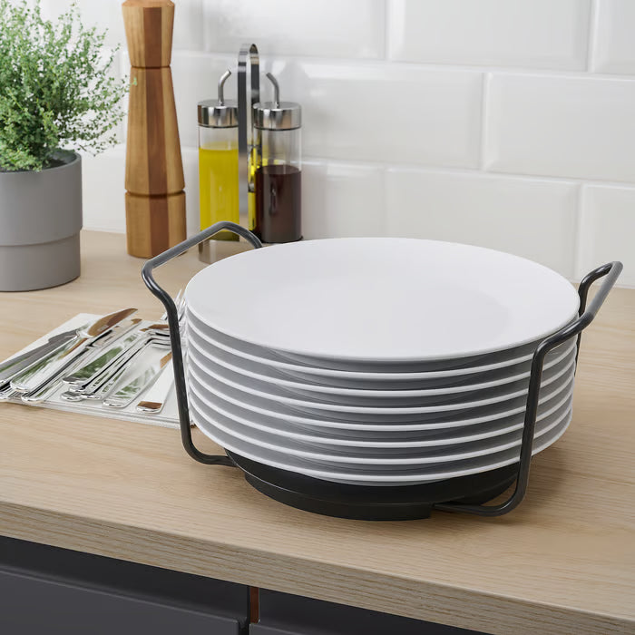 Carrying IKEA UPPDATERA plate holder with plates to dining table