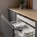 IKEA UPPDATERA anthracite plate holder organising white plates inside an open kitchen drawer