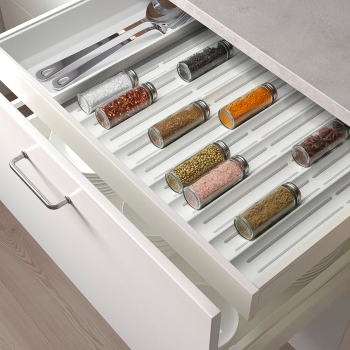 IKEA UPPDATERA anti-slip spice rack keeping spice jars securely in place inside a kitchen drawe