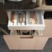 IKEA UPPDATERA spice drawer organiser holding jars upright and visible to prevent spills and save space