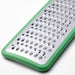 Close-up of the bright green handle on the IKEA UPPFYLLD grater with hanging storage hole