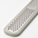 Close-up of IKEA UPPFYLLD grater handle featuring a hole for easy hanging storage