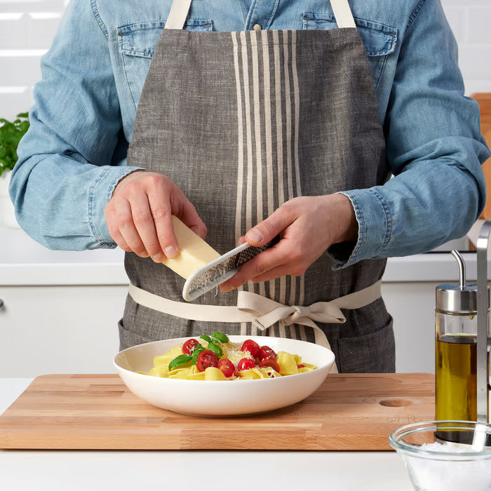 IKEA UPPFYLLD off-white grater showing dual-sized holes for fine and coarse grating