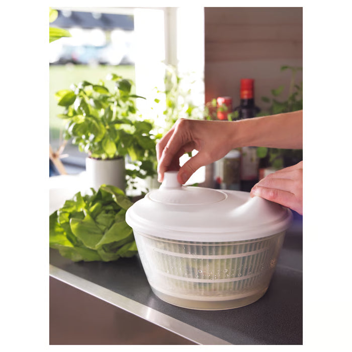 IKEA UPPFYLLD white salad spinner on countertop with fresh lettuce drying inside