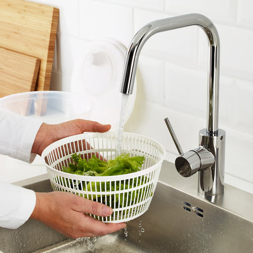  Hands rinsing lettuce in IKEA UPPFYLLD salad spinner basket under kitchen tap