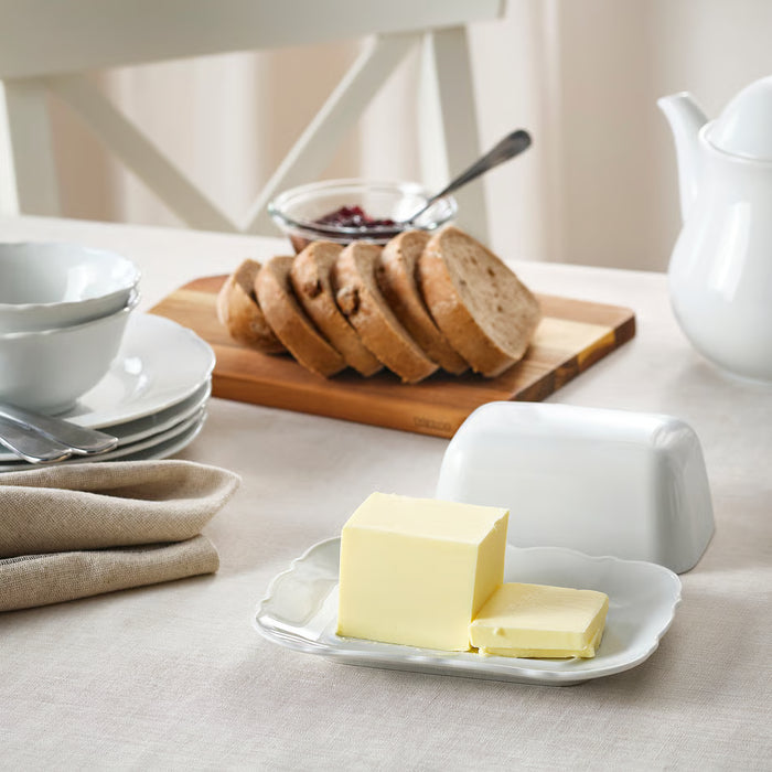 IKEA UPPLAGA butter dish styled on breakfast table with plates bowls bread and napkins