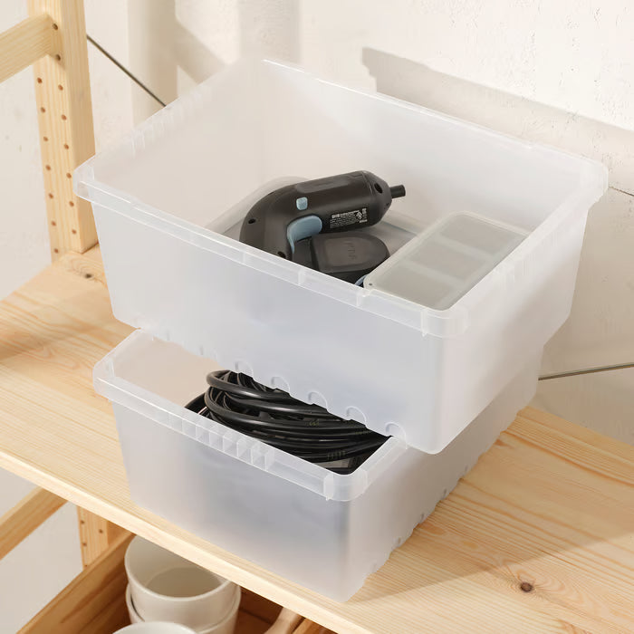 IKEA UPPSNOFSAD transparent storage boxes stacked on shelf holding cables drill and charger