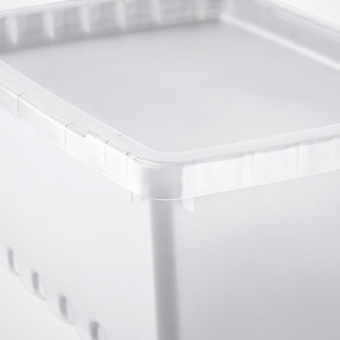 Close-up corner detail of IKEA UPPSNOFSAD clear plastic storage box showing lid fit and build quality